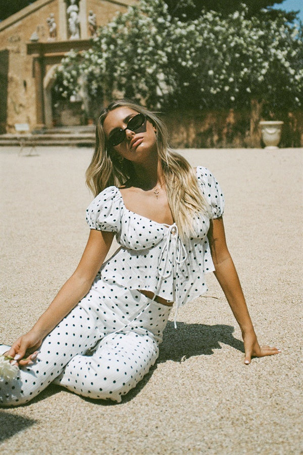 Chic Off-White Crepe Lane Pants with Black Spots
