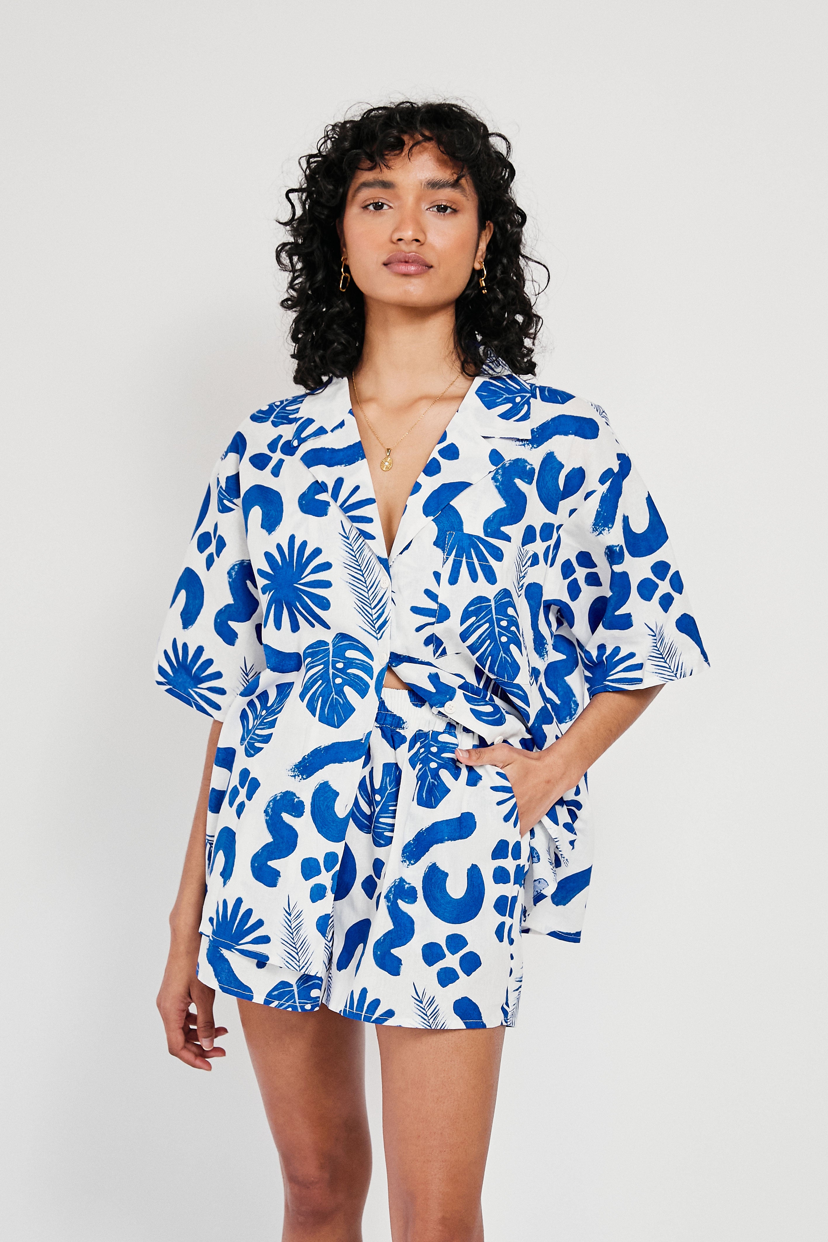 Unique Thessy Women's Top with Blue Leaf Pattern