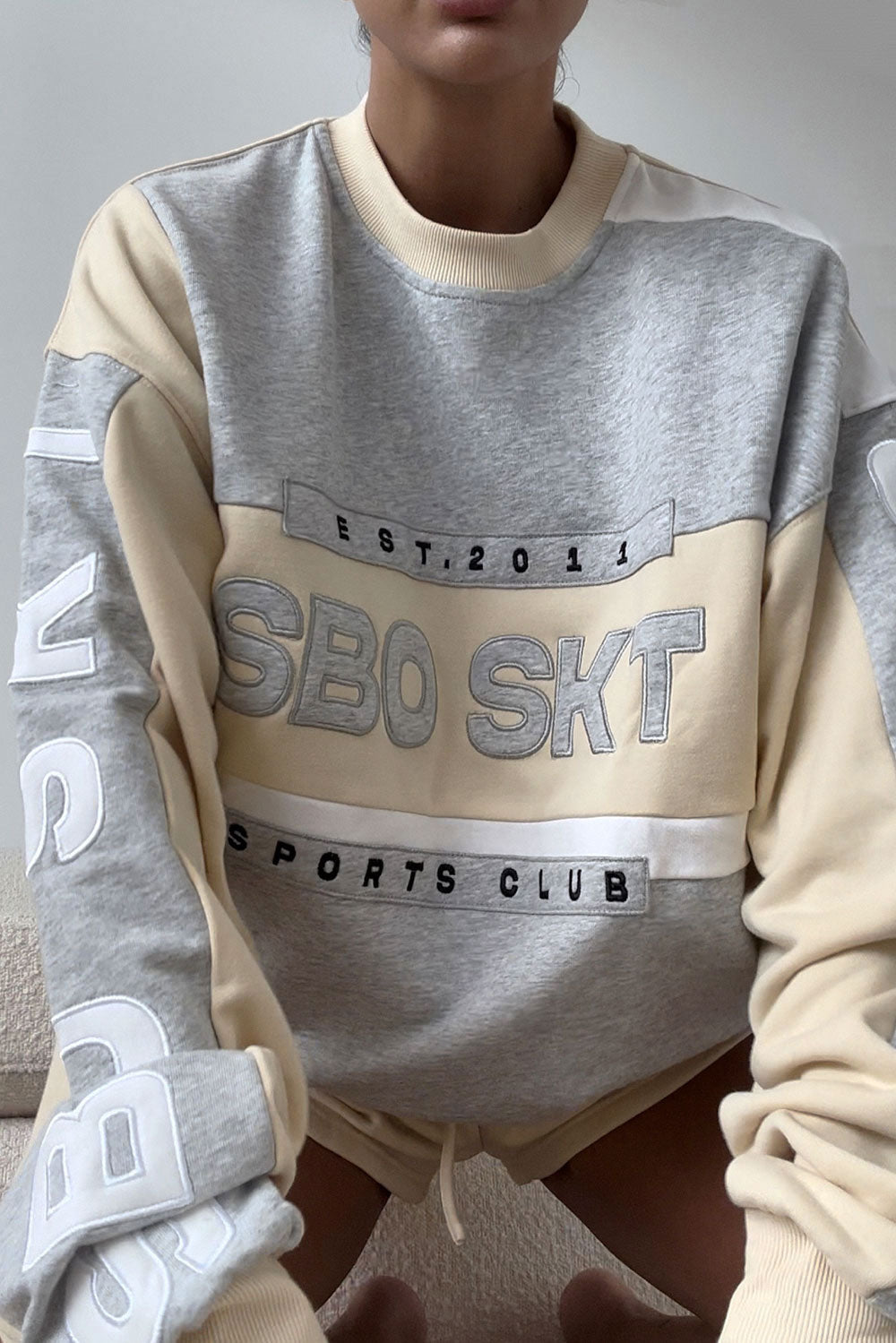 Beige Oversized Garland Sweater with Black Accents