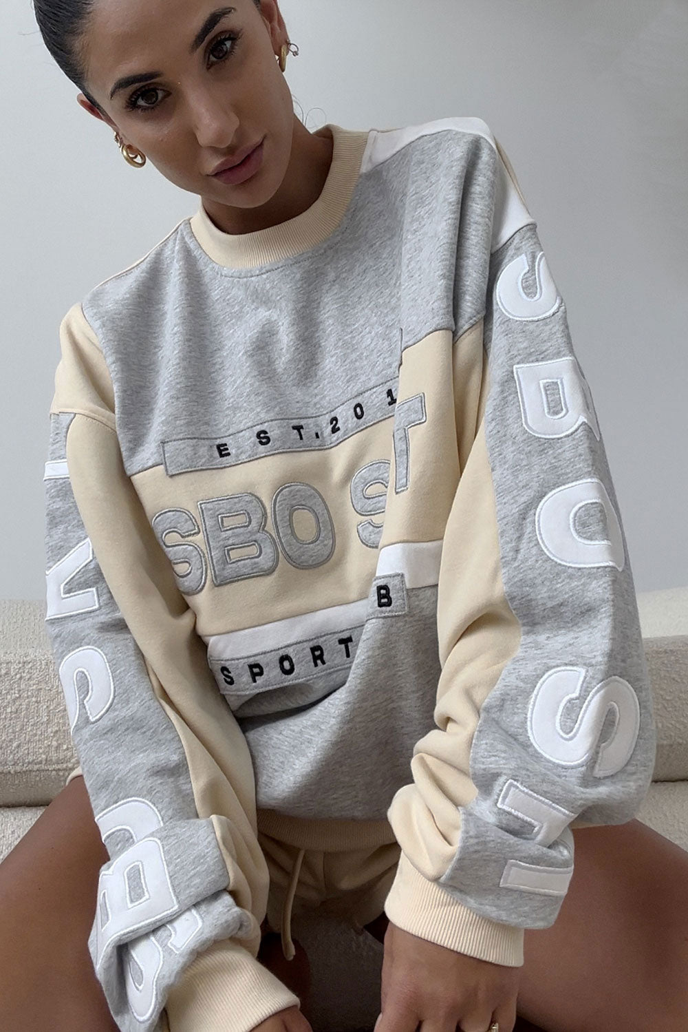 Beige Oversized Garland Sweater with Black Accents