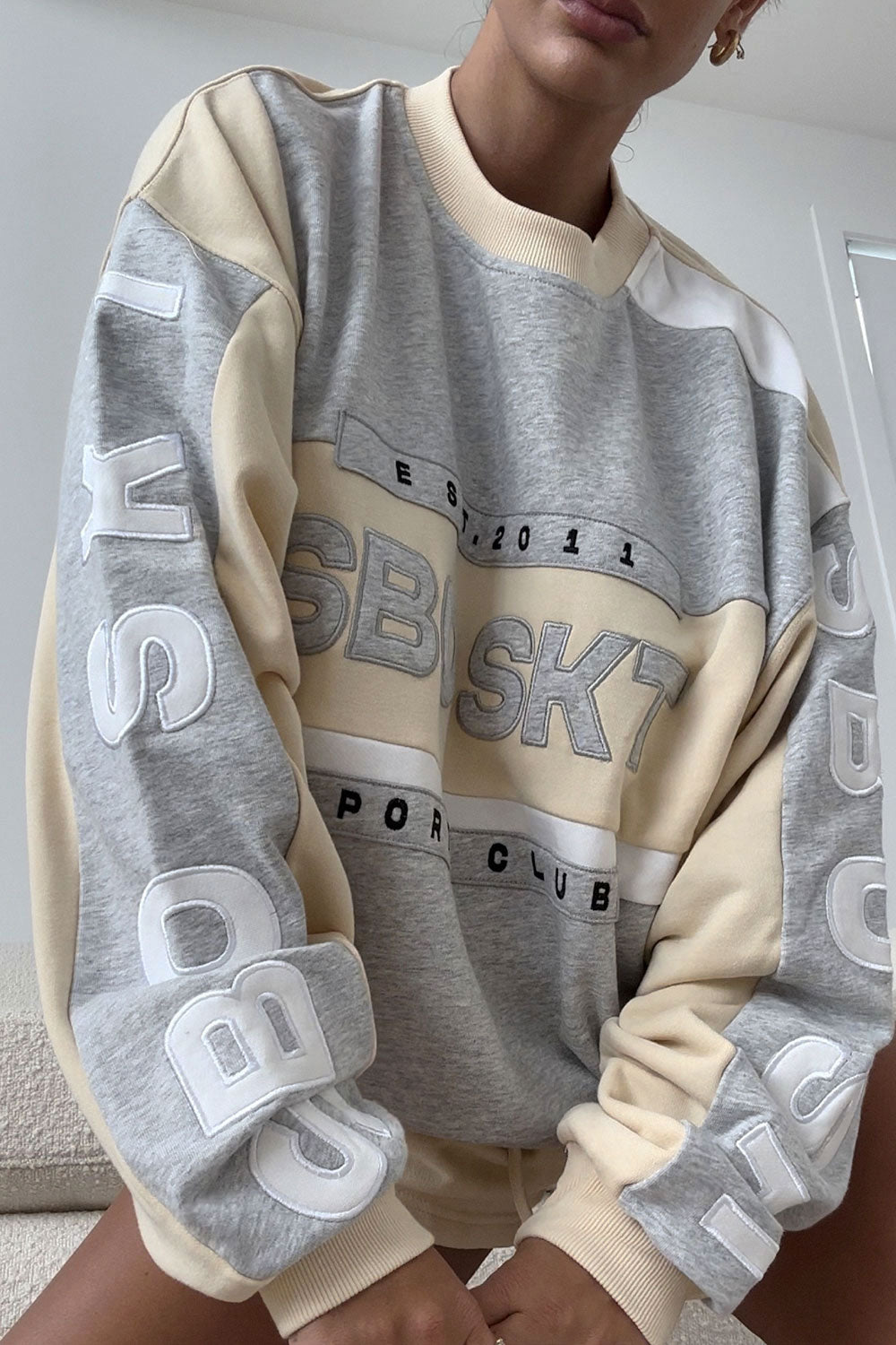 Beige Oversized Garland Sweater with Black Accents