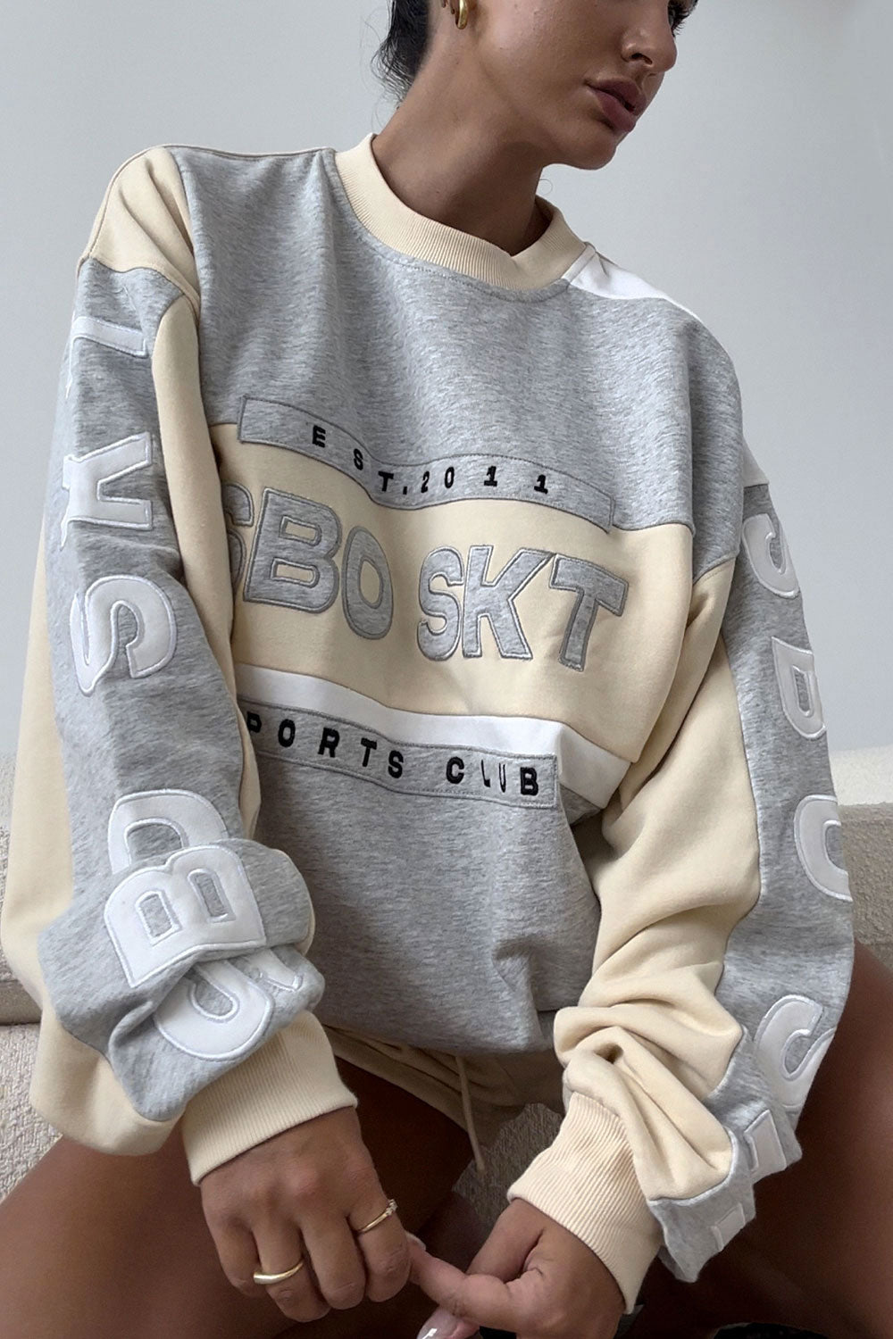 Beige Oversized Garland Sweater with Black Accents